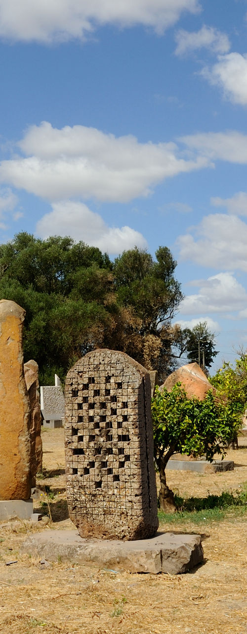 Outdoor stone sculptures under blue sky