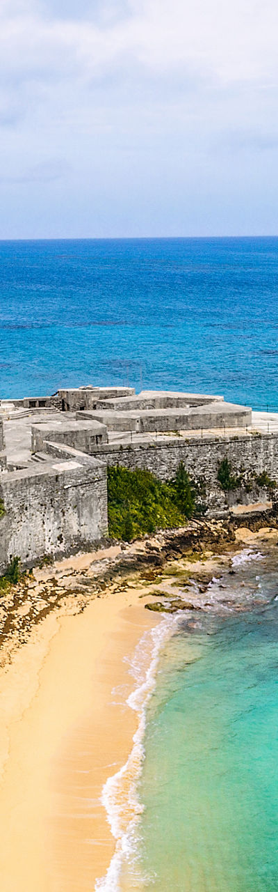 Historic coastal fort with cruise ship view