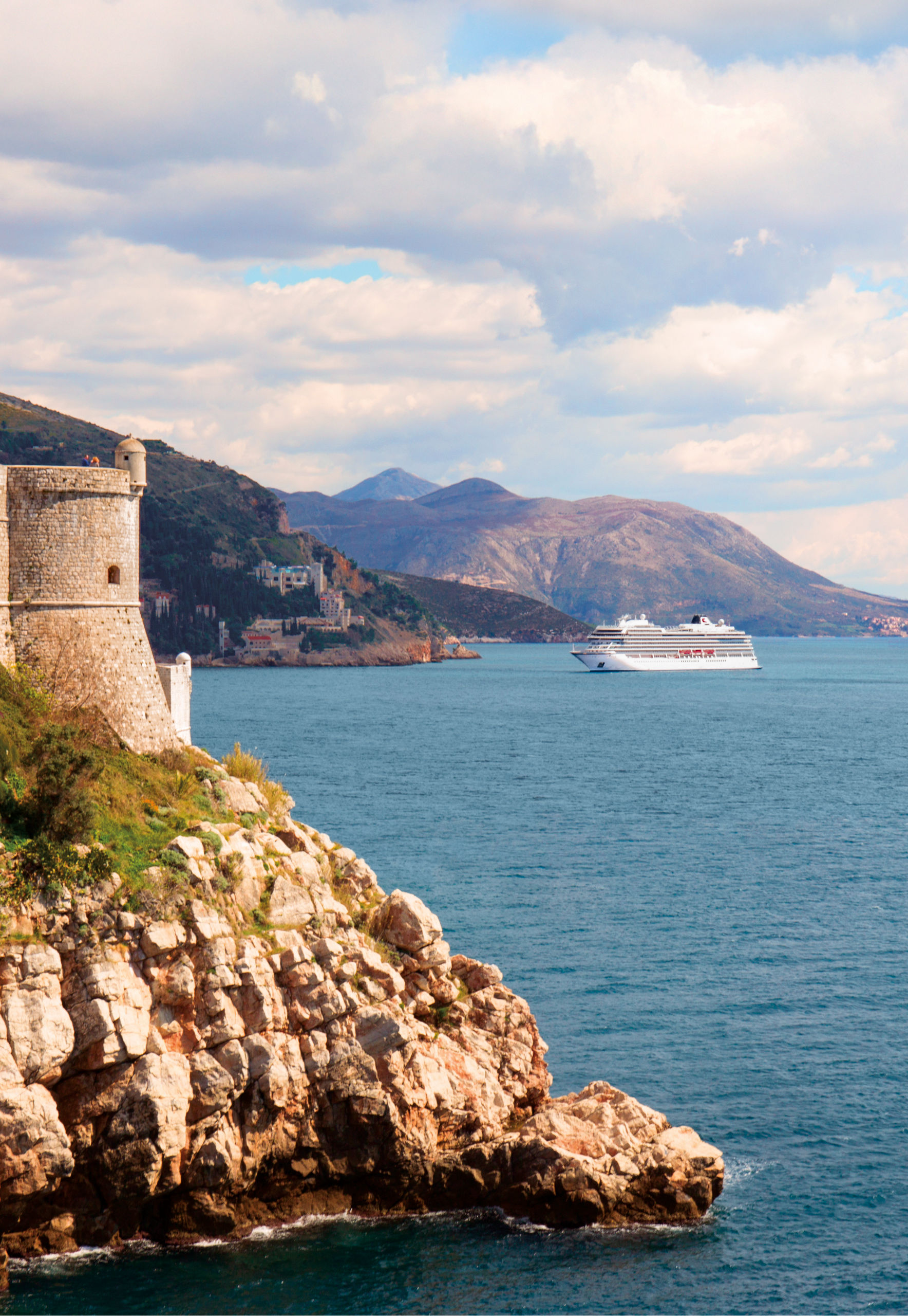 Scenic coastal fortress with cruise ship view