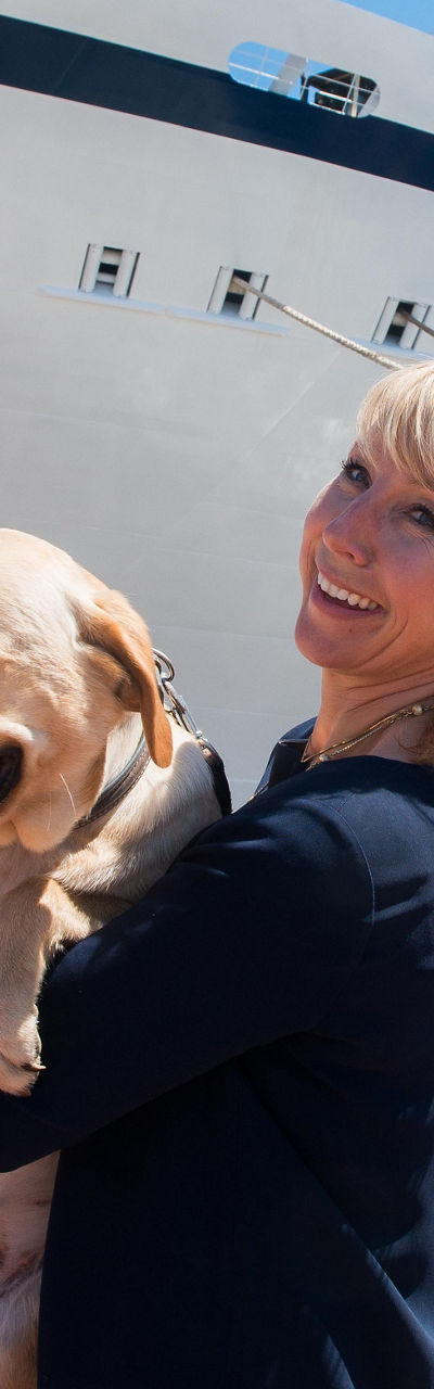Large cruise ship docked with dog