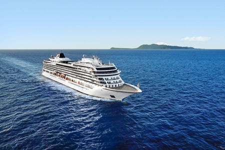 Luxury cruise ship sailing near island