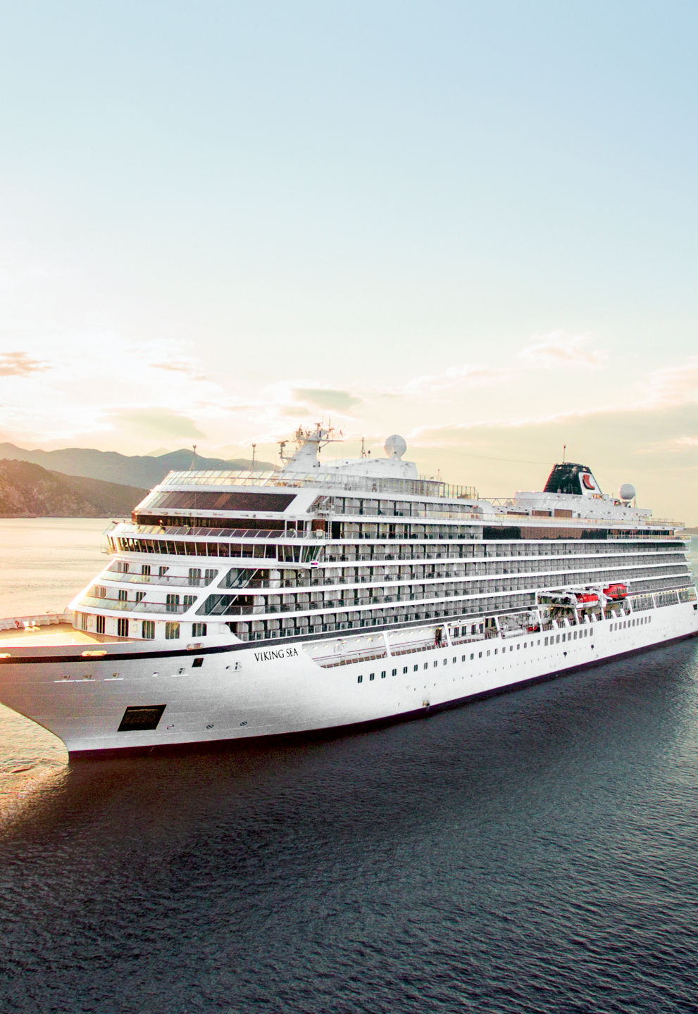 Luxury cruise ship at sunset on ocean