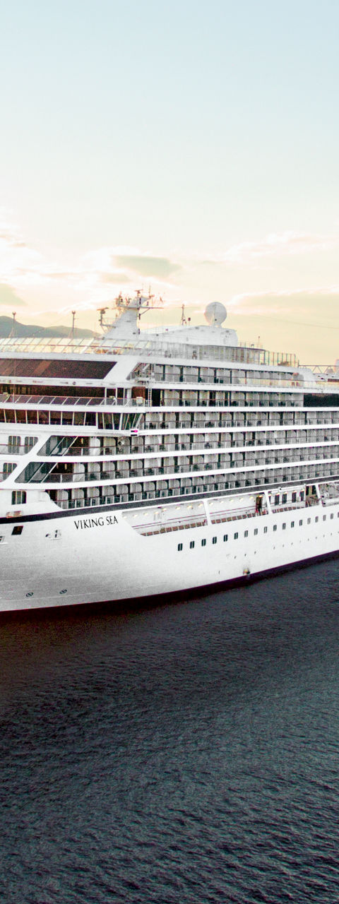 Luxury cruise ship at sunset on ocean