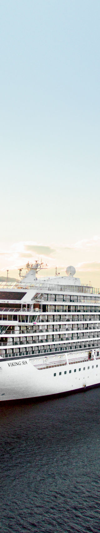 Luxury cruise ship at sunset on ocean