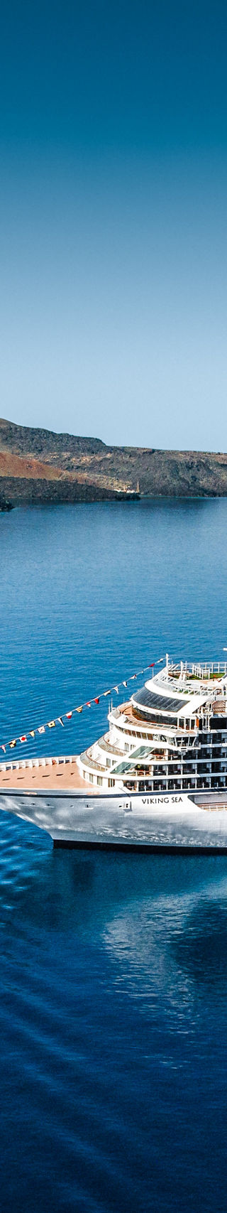 Luxury cruise ships in scenic blue waters