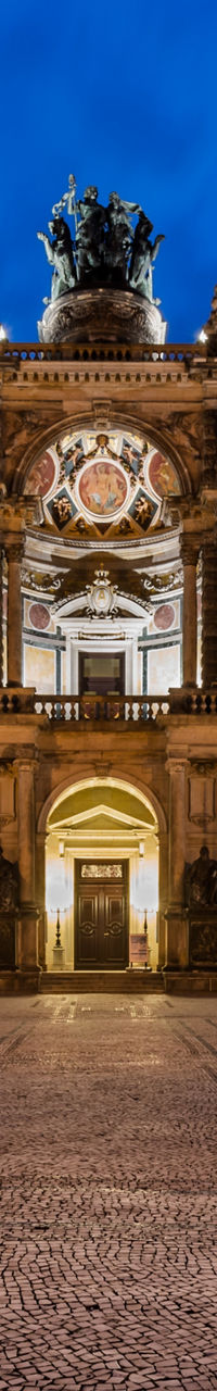 Illuminated historic opera house at dusk