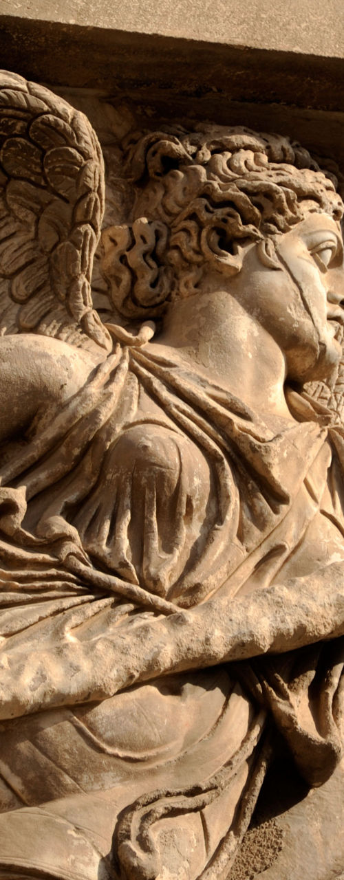 Stone angel sculpture with intricate details