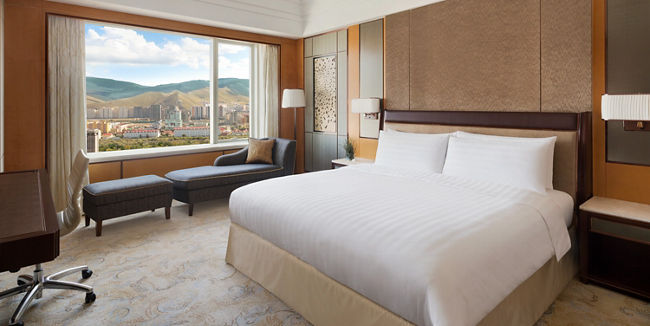 Modern hotel room with scenic city view