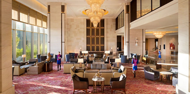 Luxurious hotel lobby with grand chandeliers