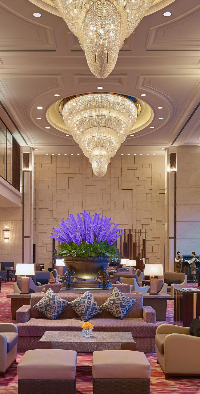 Luxurious hotel lobby with grand chandeliers
