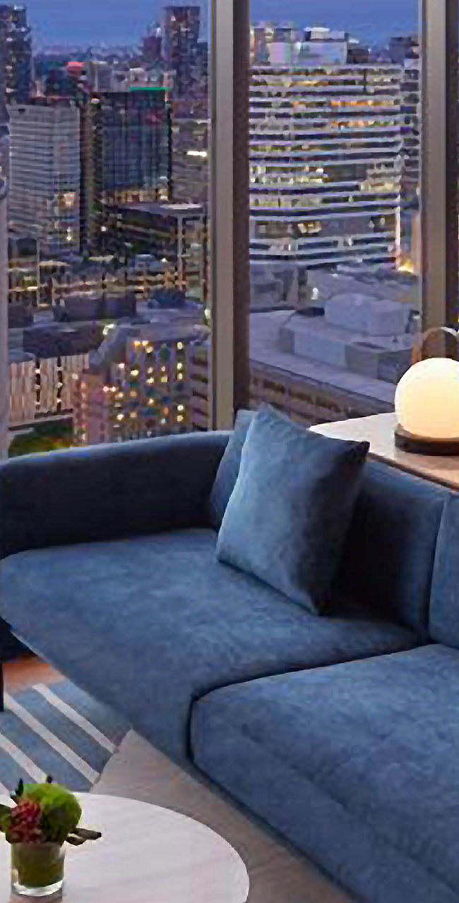 Modern Lounge Overlooking City Skyline at Dusk