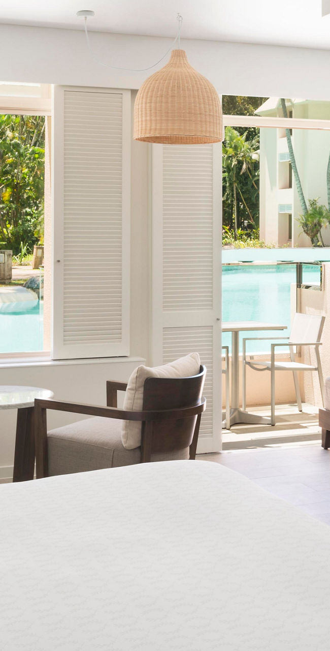 Bright hotel room with pool view