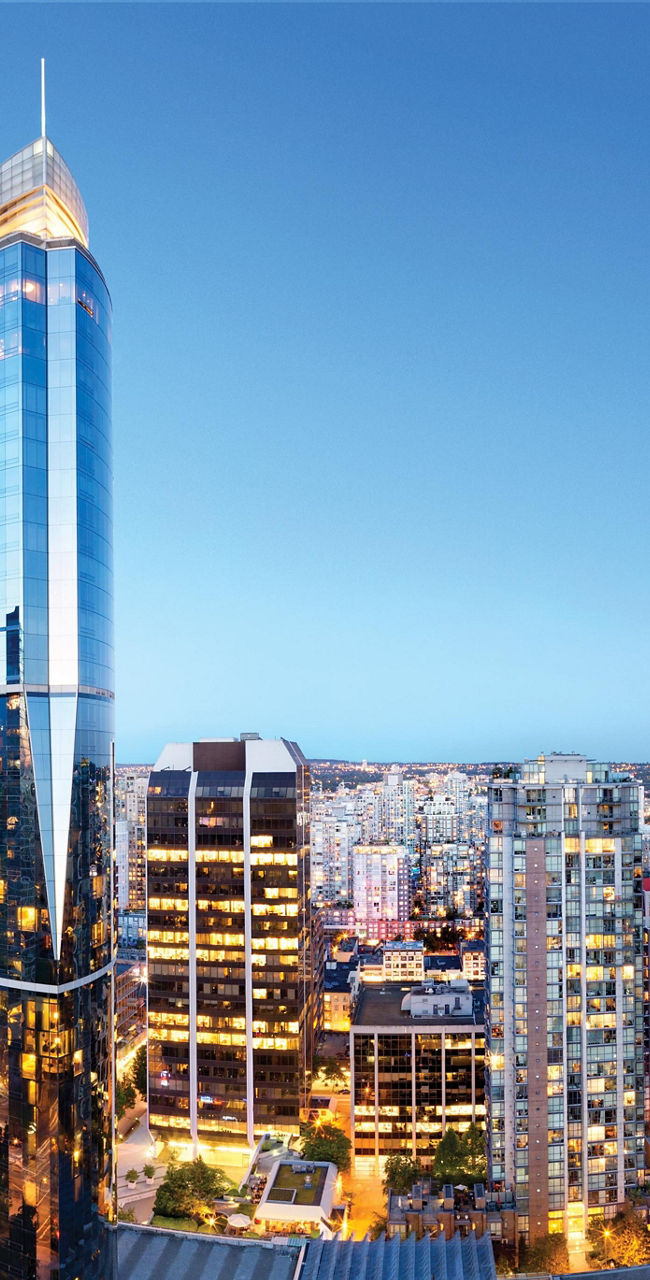 Panoramic cityscape of downtown Vancouver at dusk