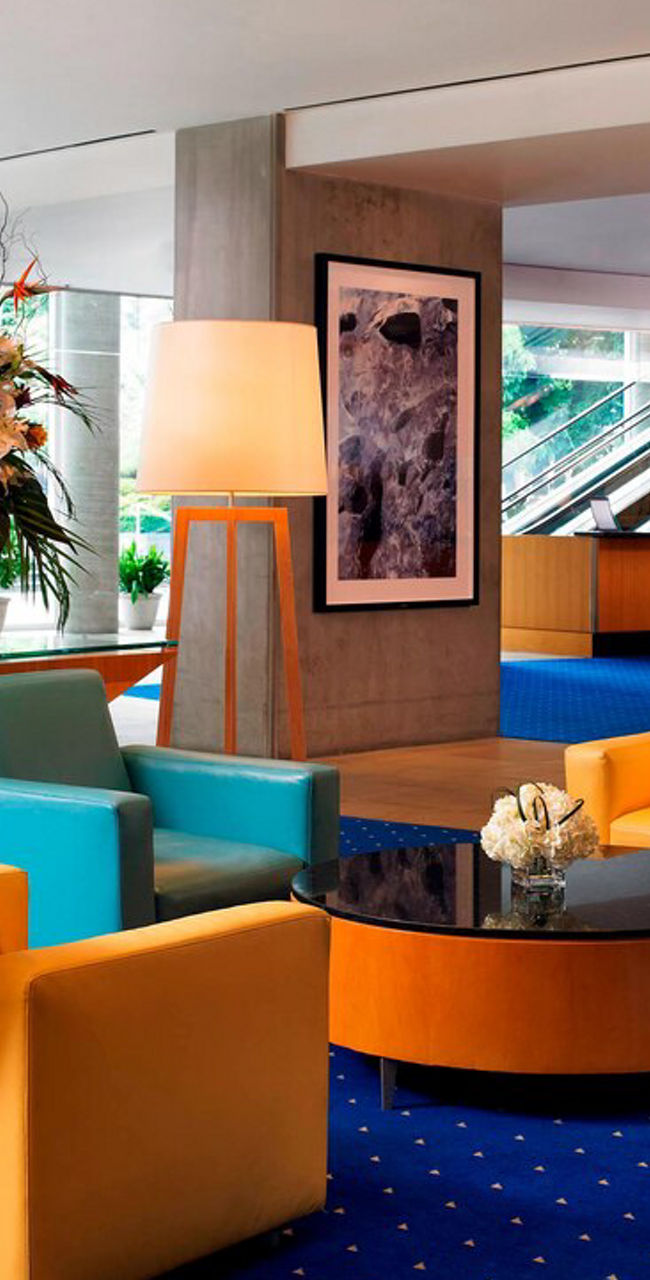 Modern hotel lobby with vibrant seating