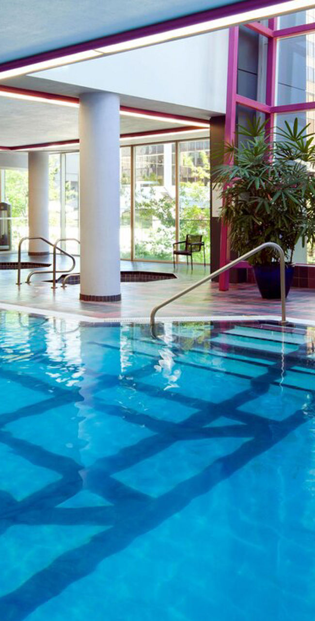 Indoor pool with modern gym view
