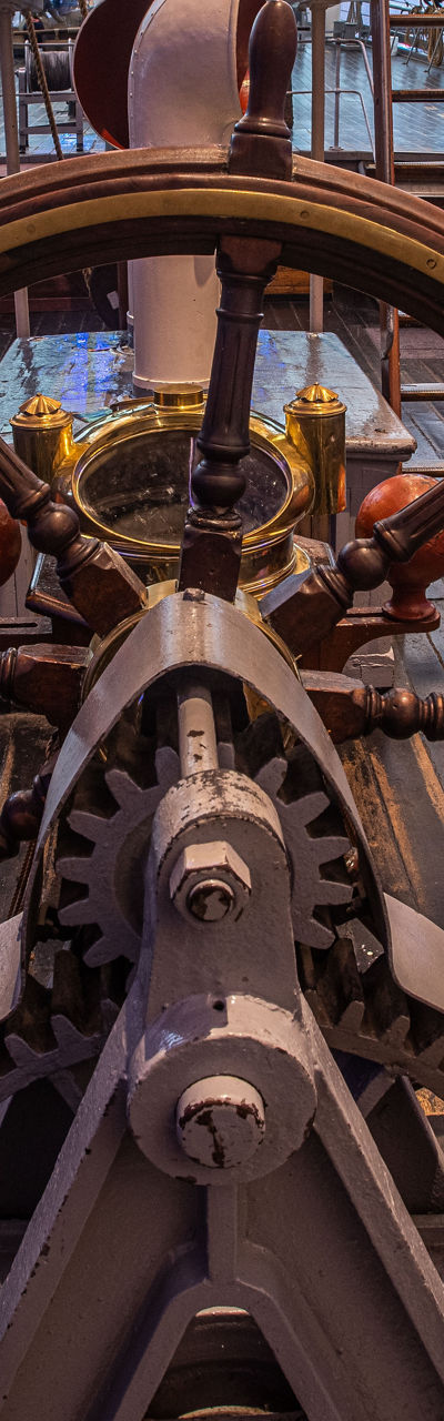 Historic ship helm with wooden deck