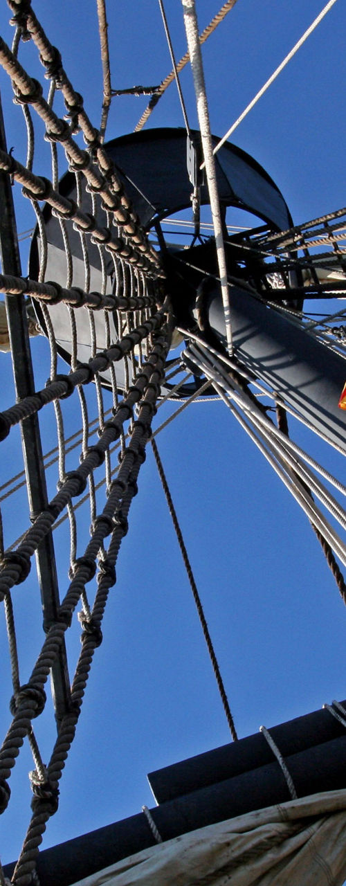 Sailing ship mast with rigging ropes
