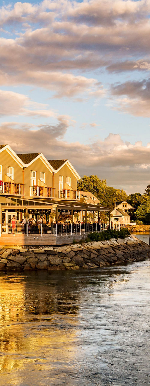 Scenic waterfront with boats at sunset