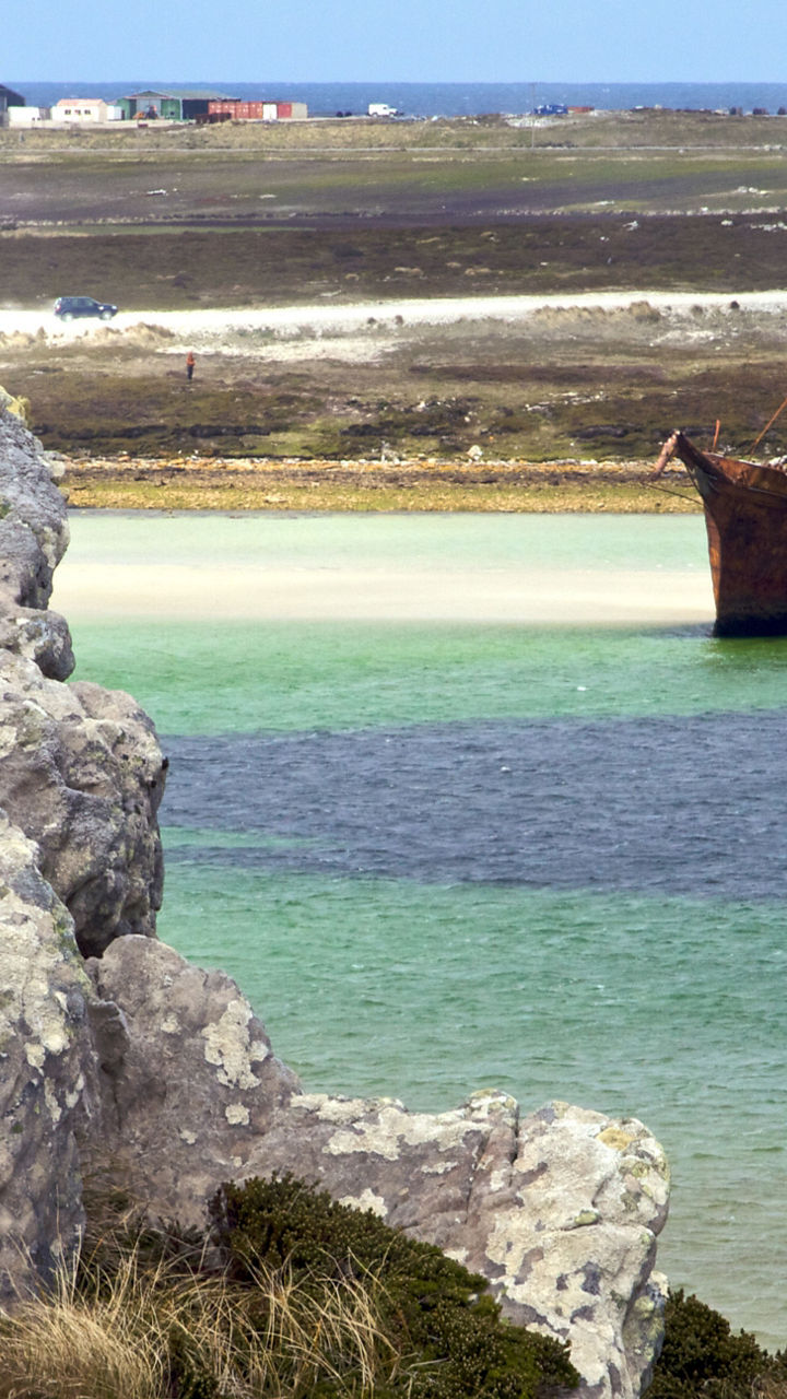 Rustic shipwreck in coastal lagoon setting
