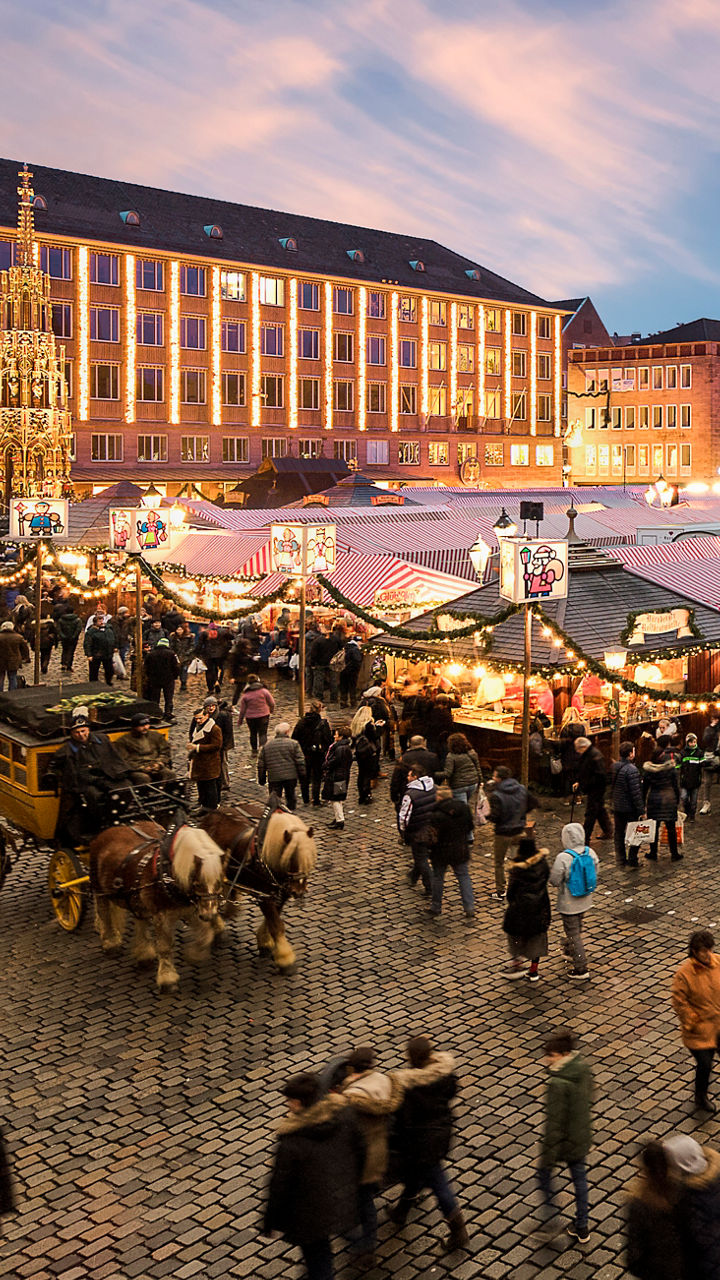 Crowded Christmas market in historic town square