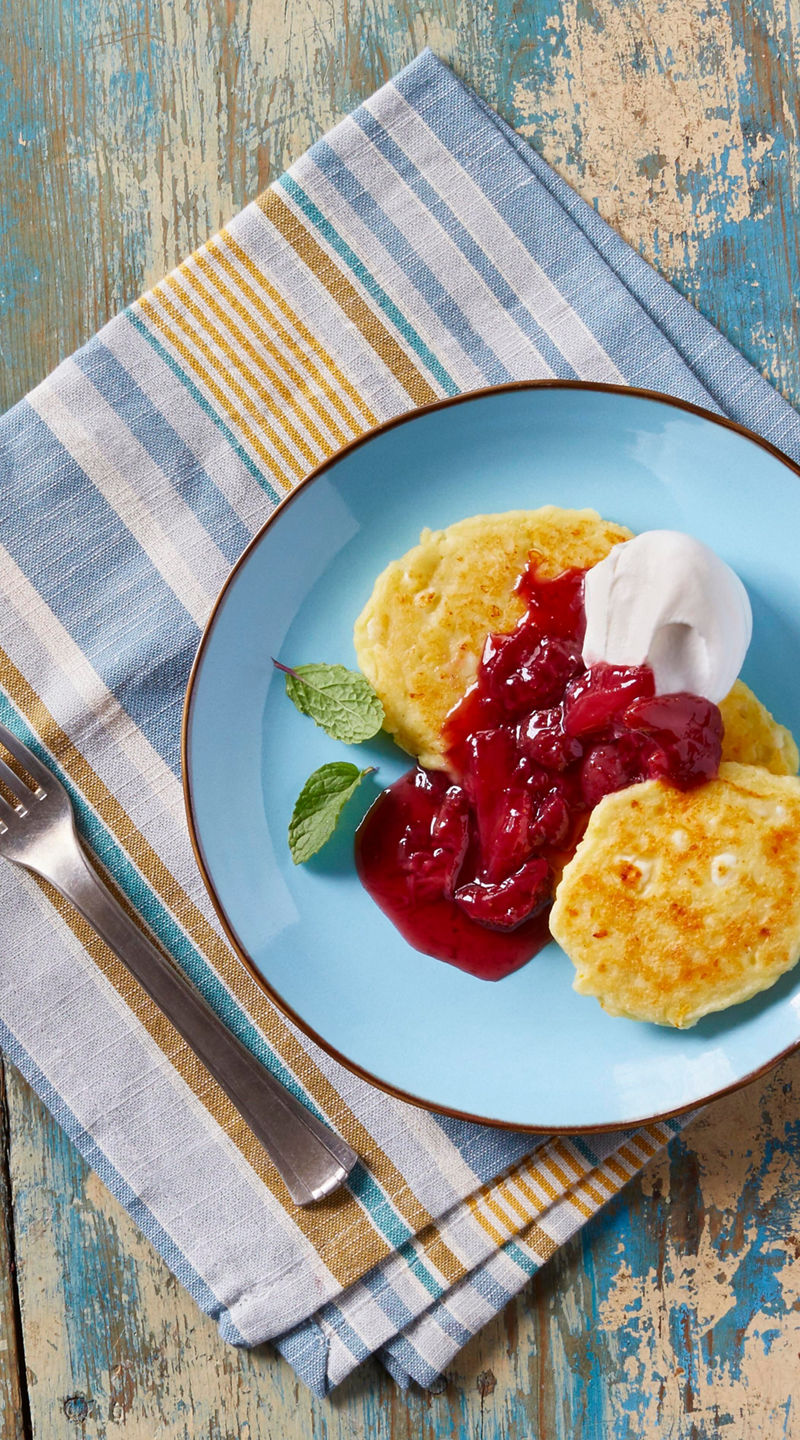 Waffles with berry sauce and coffee