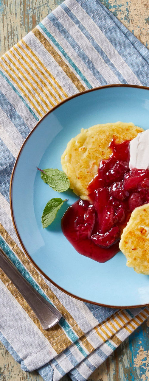 Waffles with berry sauce and coffee