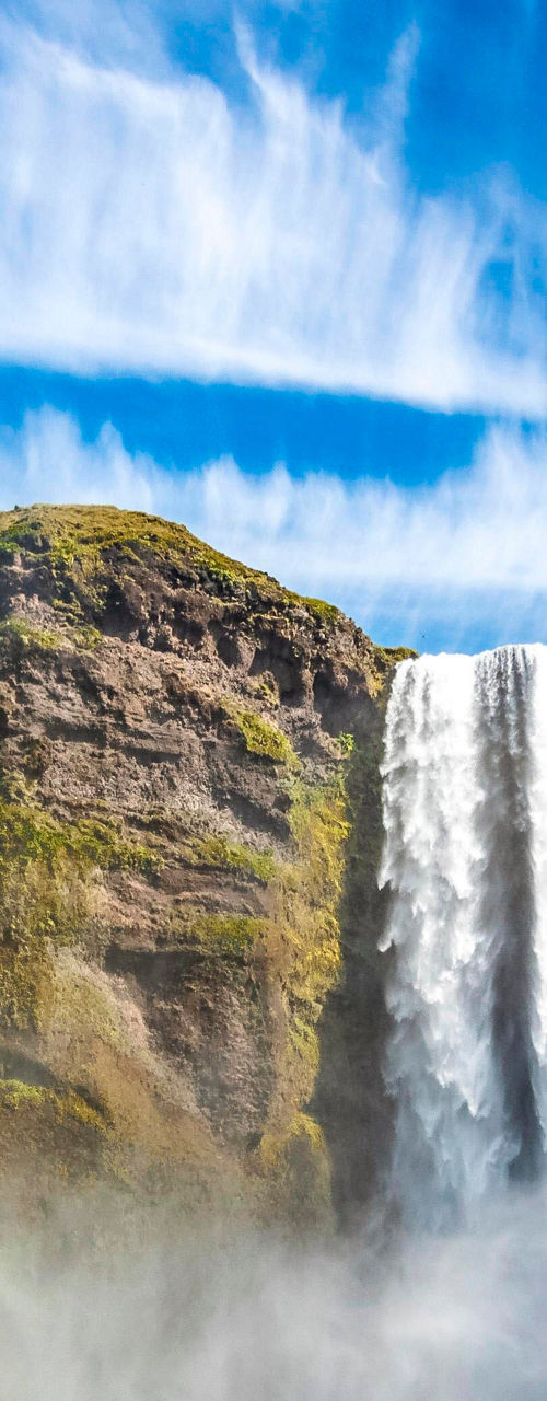 Tourists at Skógafoss waterfall in Iceland