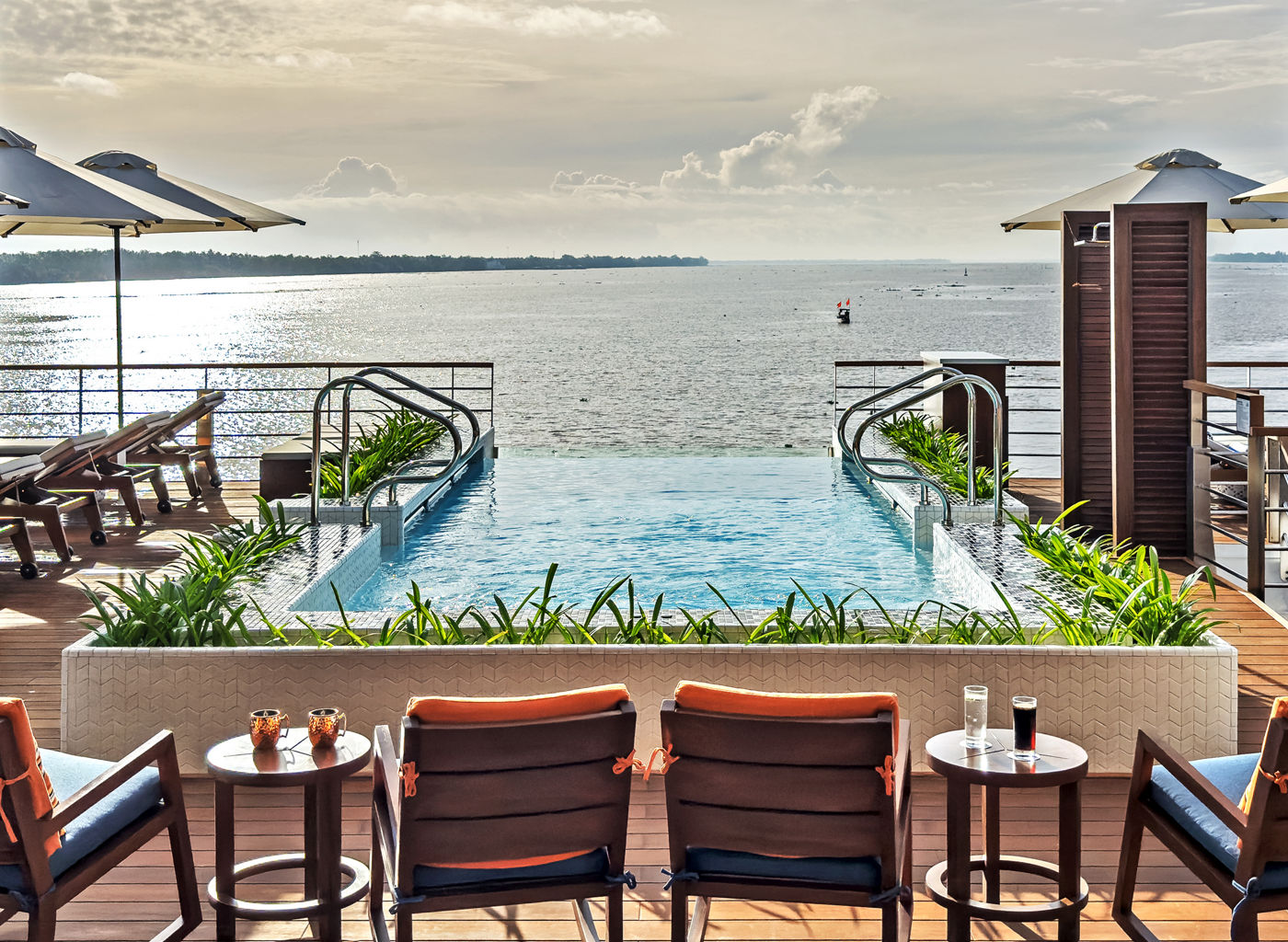Luxury waterfront pool with lounge seating