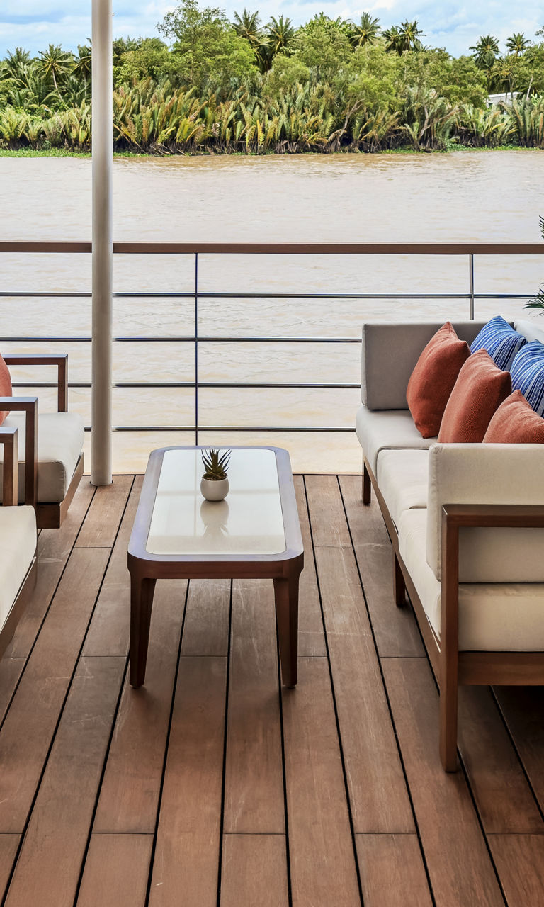 Outdoor lounge seating on river cruise deck
