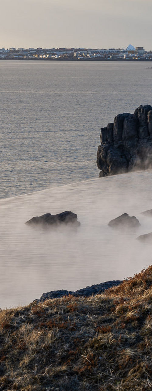 Coastal hot springs with rocky cliffs
