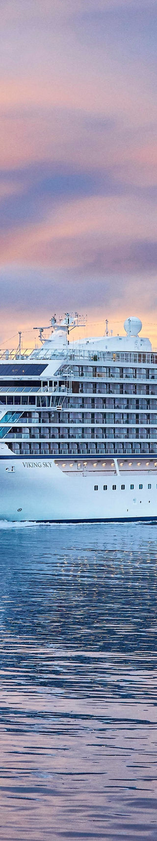 Luxury cruise ship at sunset on calm waters