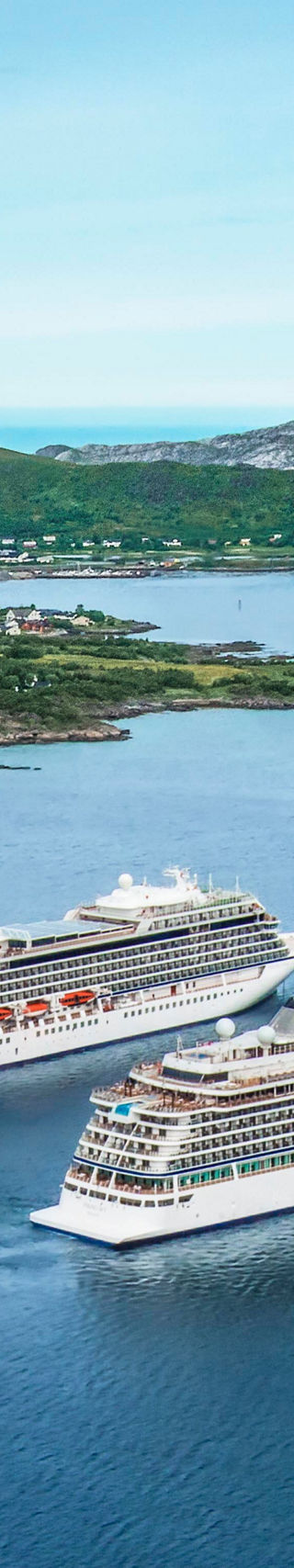 Two cruise ships in scenic Nordic waters