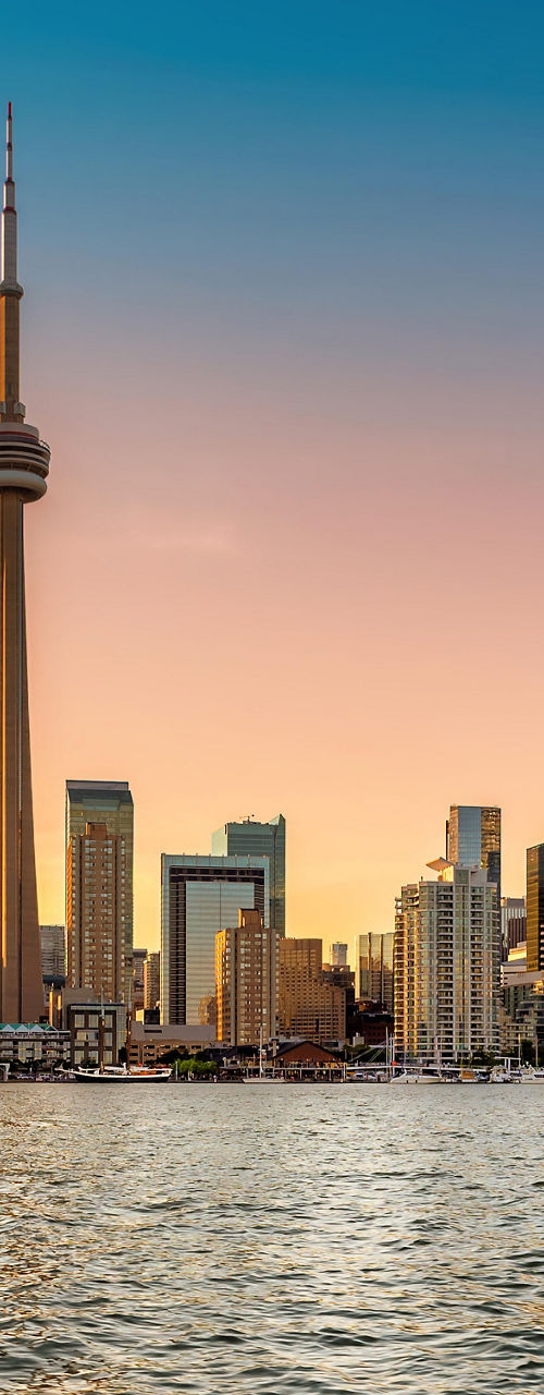 Toronto skyline at sunset with waterfront view