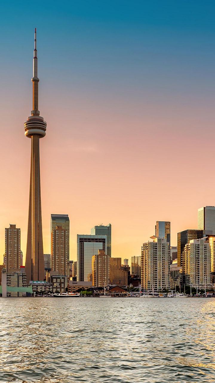 Toronto skyline at sunset with waterfront view