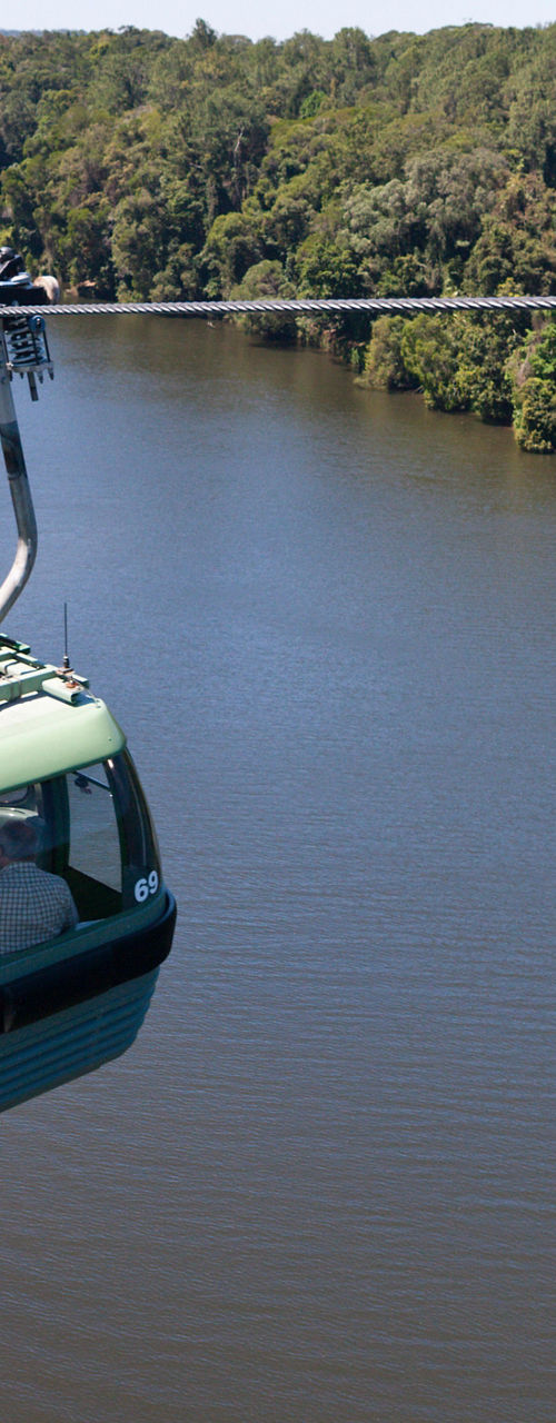 Cable car over scenic river landscape