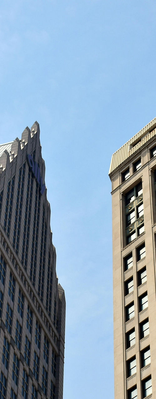 Urban skyscrapers under clear blue sky