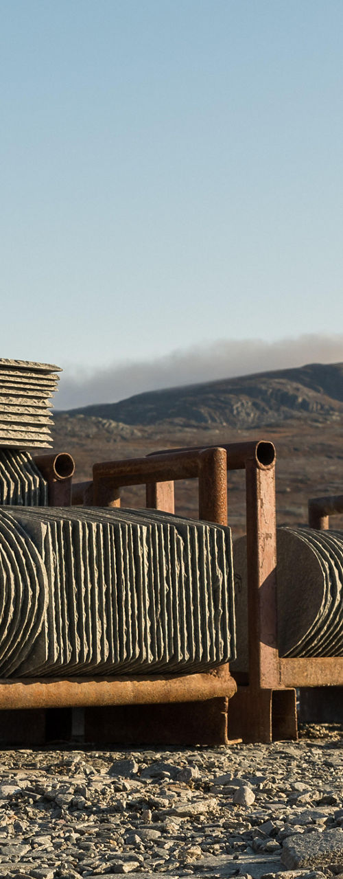 Stone slabs stacked in outdoor quarry