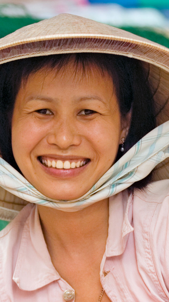 Woman at vibrant outdoor market stall