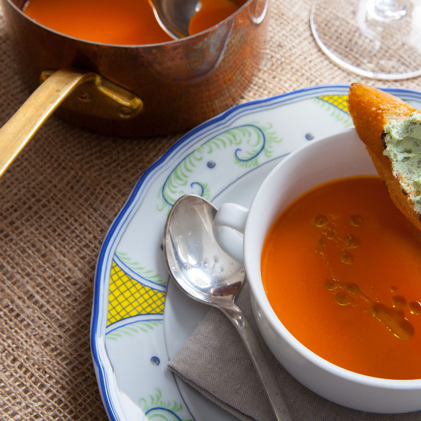 Tomato soup with bread and copper pot