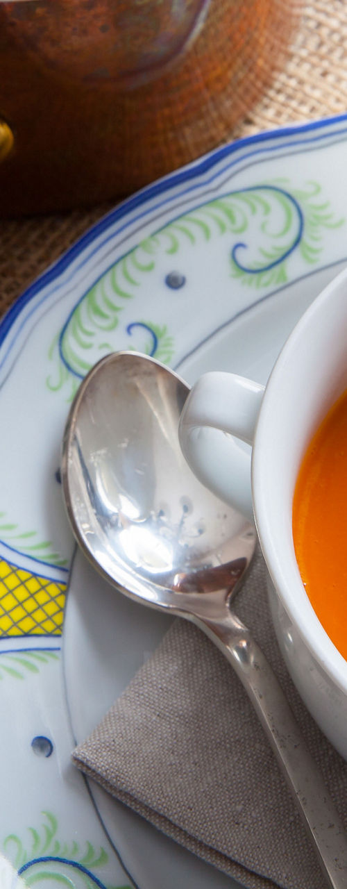 Tomato soup with bread and copper pot