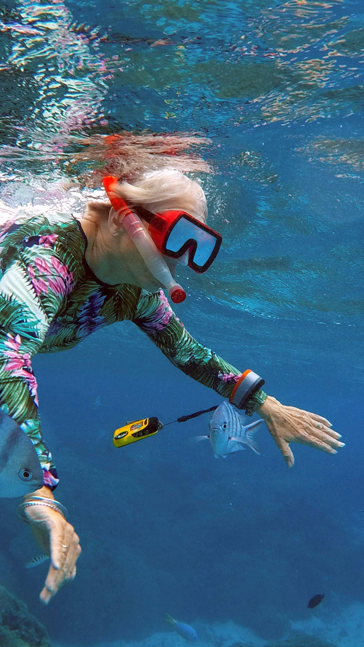 Woman snorkeling in tropical reef waters