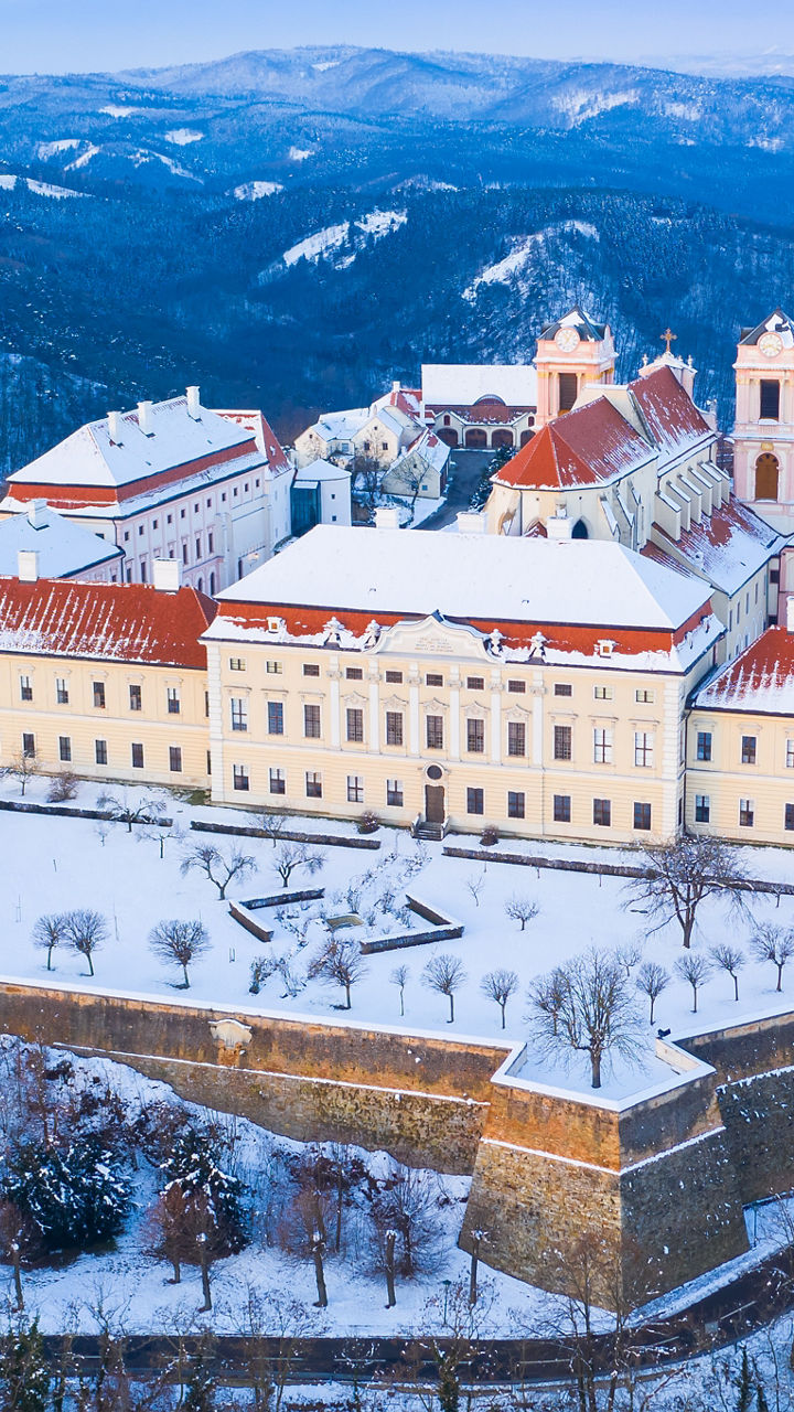 Snow-covered monastery in winter landscape