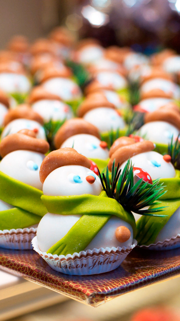 Festive snowman cupcakes in bakery display