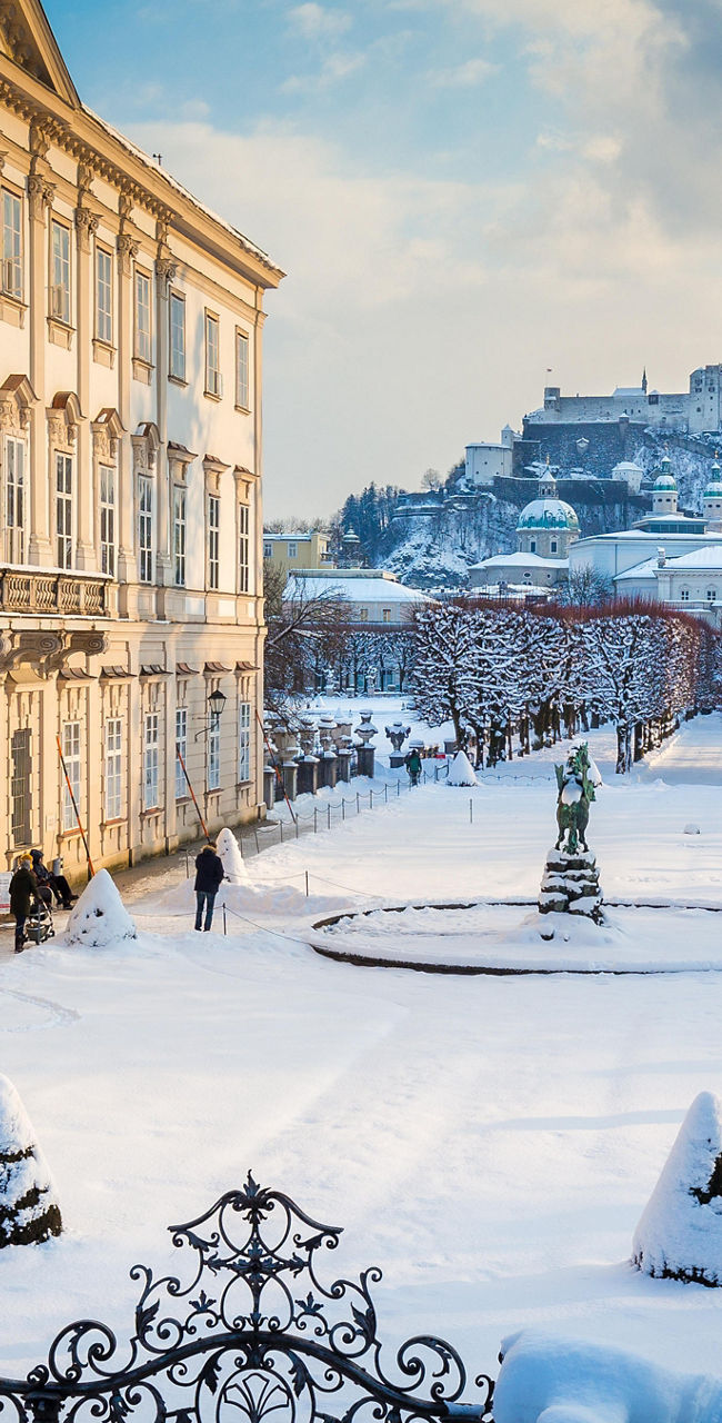 Snow-covered Mirabell Palace and Gardens in winter