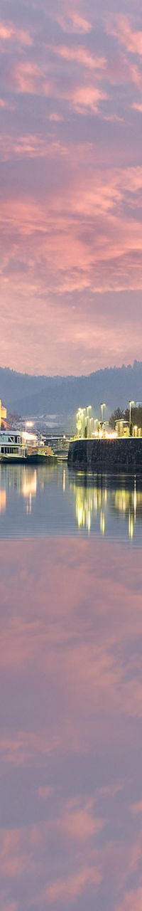Scenic riverside view of Passau at sunset