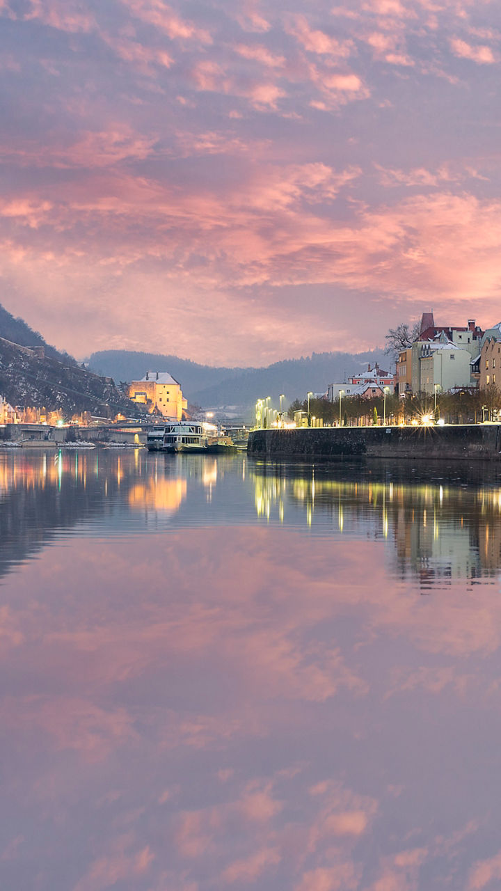 Scenic riverside view of Passau at sunset