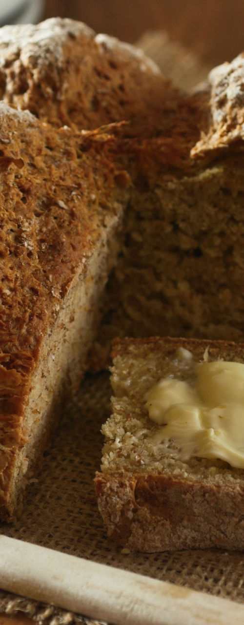 Rustic bread loaf with butter spread