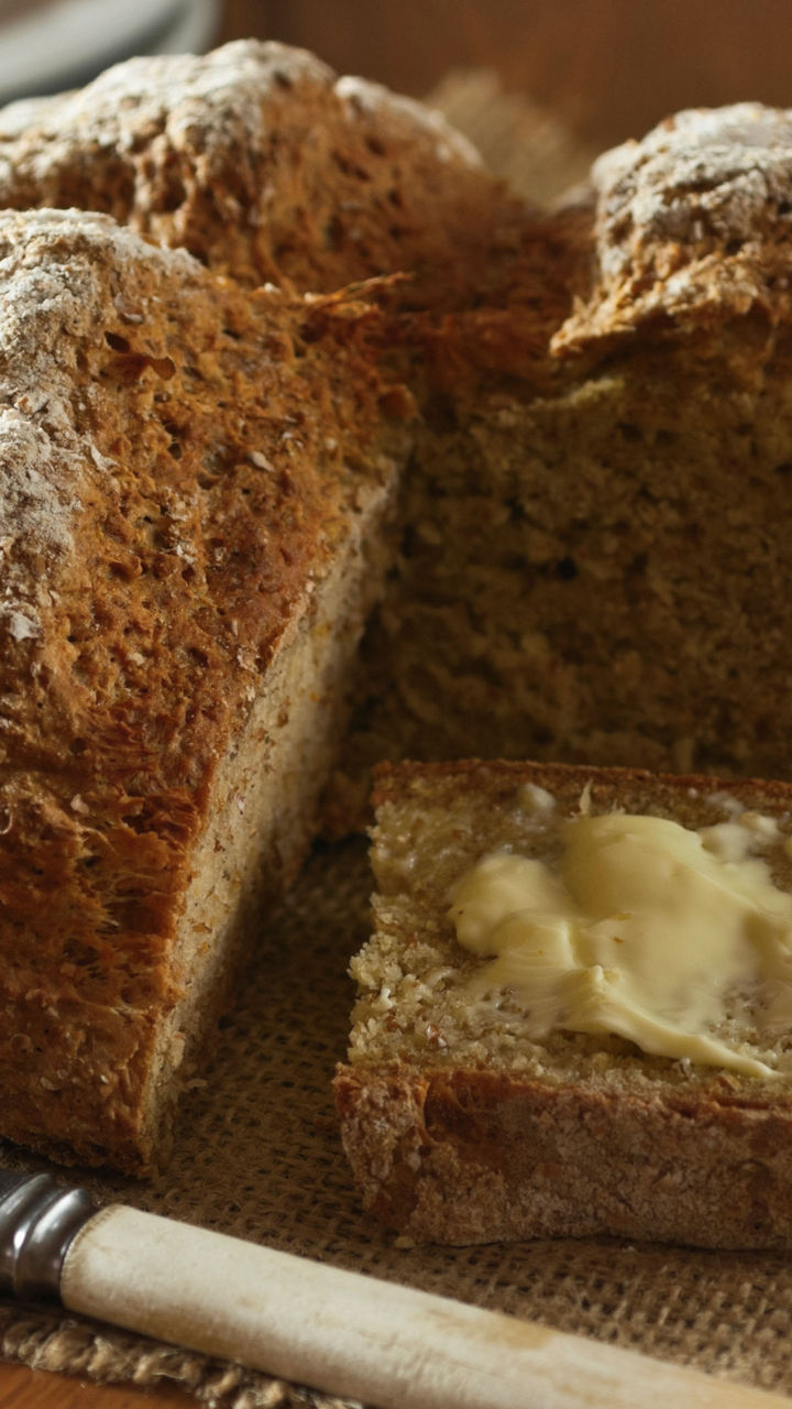 Rustic bread loaf with butter spread