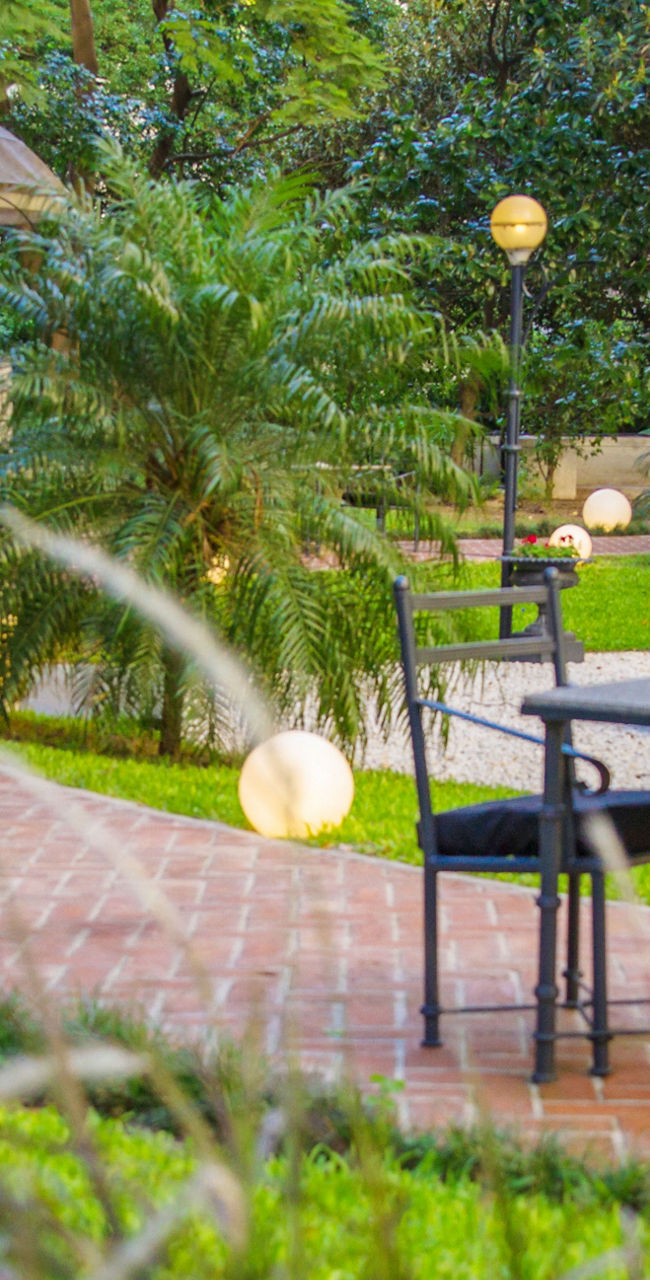 Outdoor garden seating with fountain view