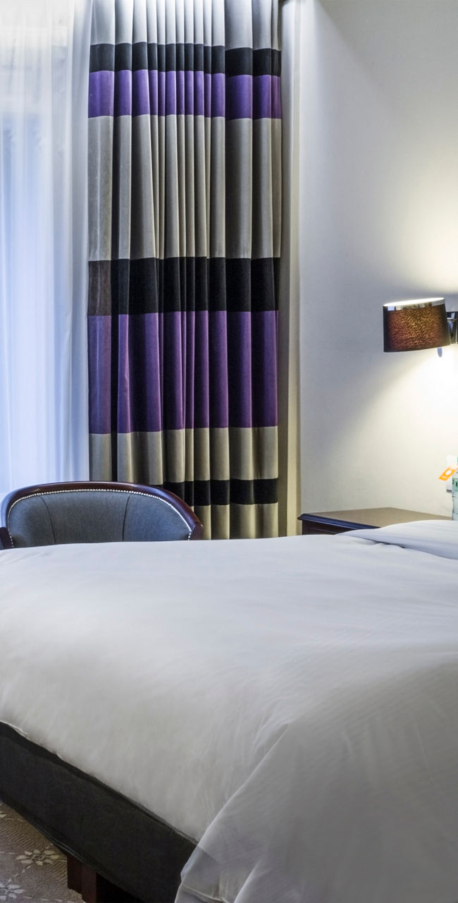 Modern hotel room with cozy decor